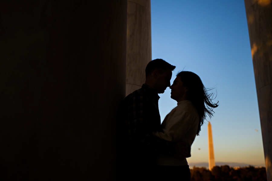 A Silhouette of a couple with the Washington Monument in the background.
